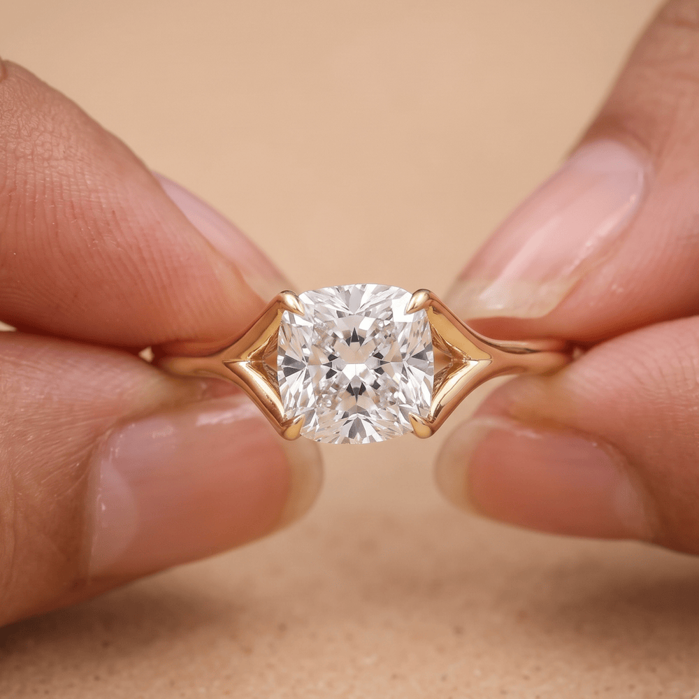 Ethically sourced cushion solitaire diamond ring on hand