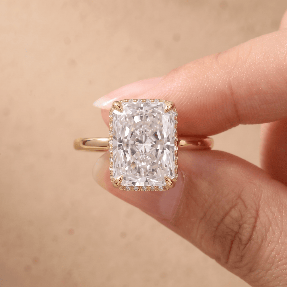 Radiant hidden halo diamond ring on model's hand