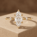 Marquise cut moissanite engagement ring with thin wedding band
