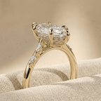 Side view of 14K yellow gold cathedral marquise diamond ring