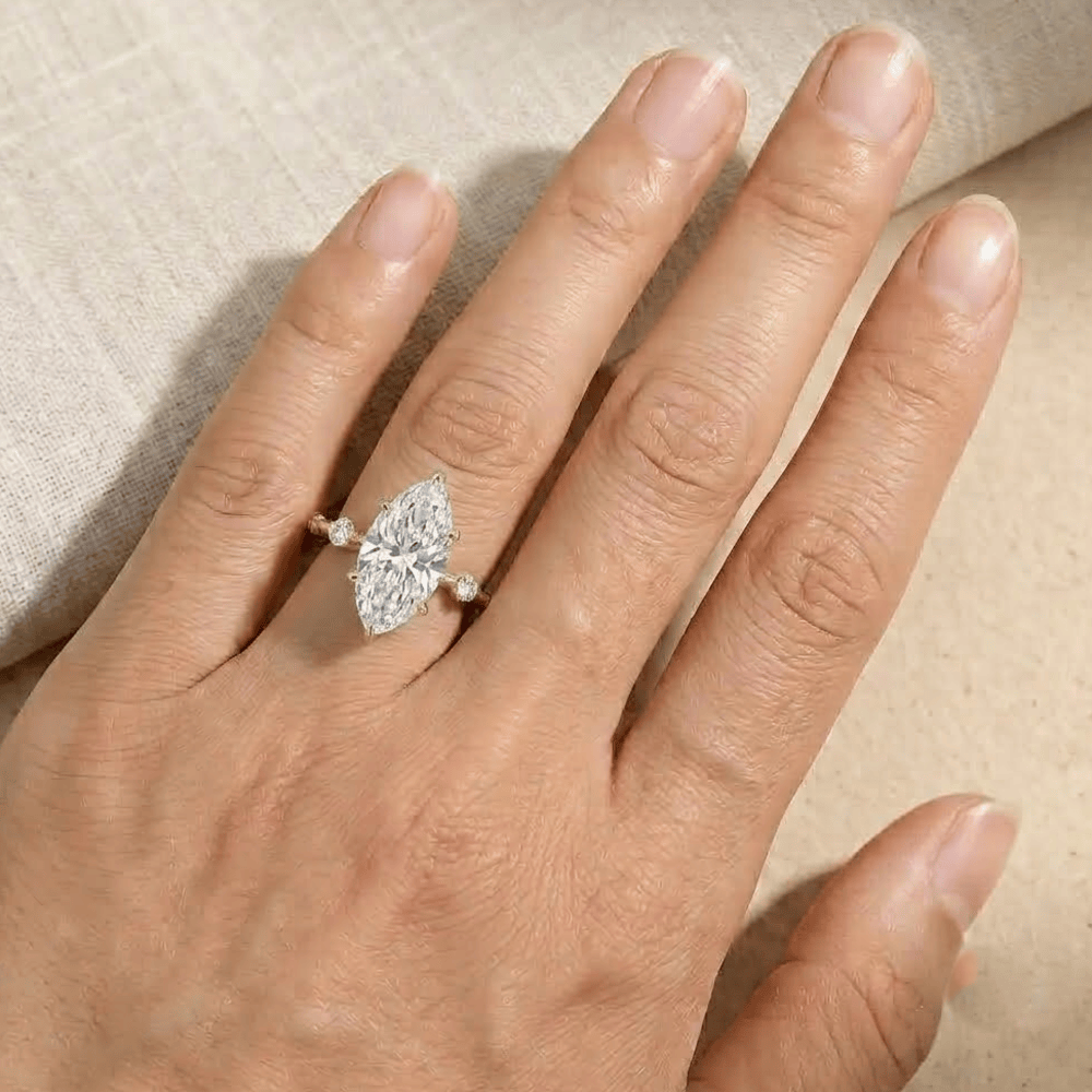 Delicate 14K gold promise ring with marquise diamond