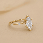 Thin 14K gold band with marquise lab diamond center