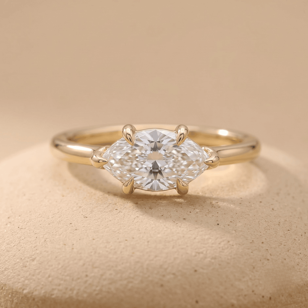 Curved 14K gold band marquise engagement ring front view