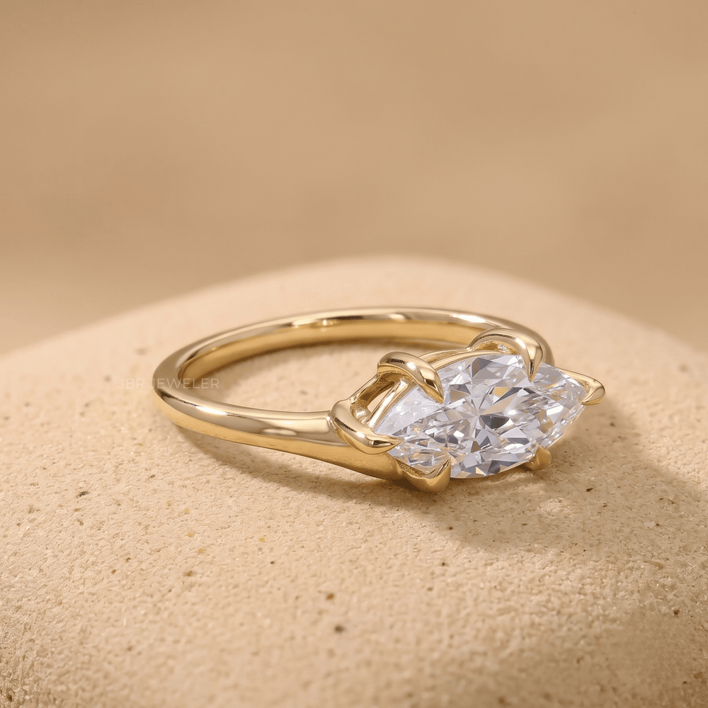 Curved band marquise engagement ring side angle