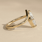 Elegant marquise solitaire engagement ring with curved band
