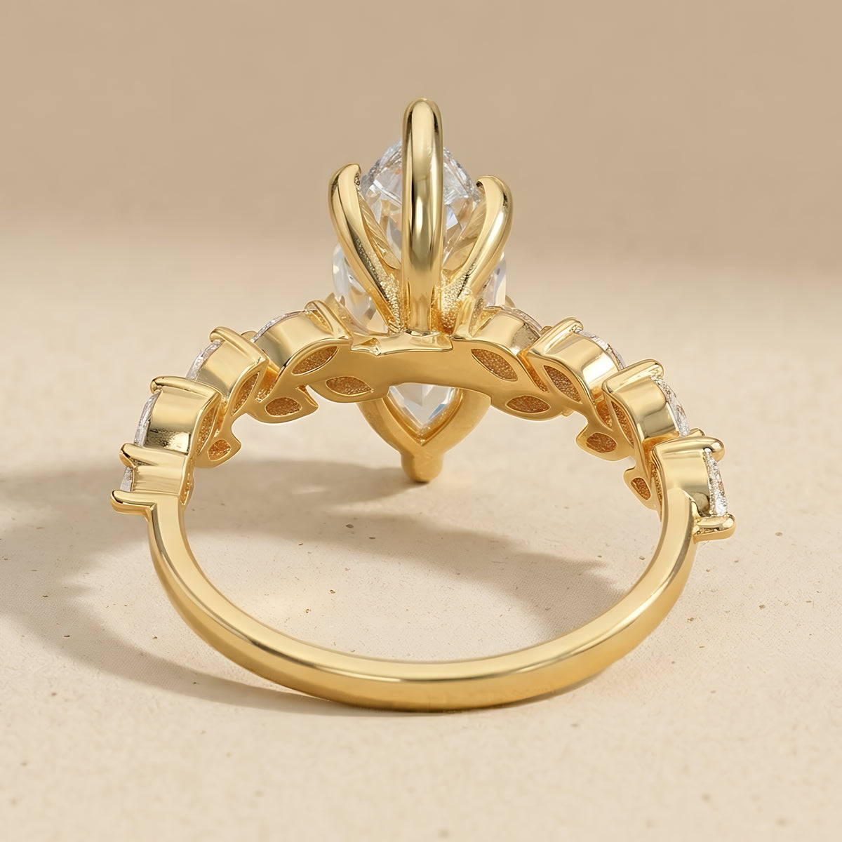 Marquise moissanite center stone on a gold band
