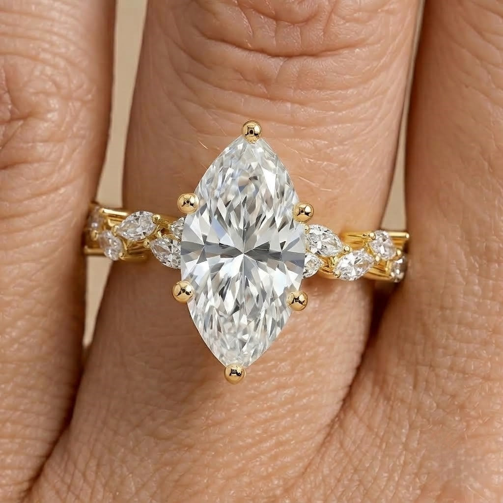 Gold promise ring with marquise moissanite