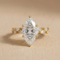 Marquise moissanite gold ring with accent stones