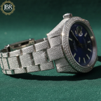 Men’s blue dial moissanite fully iced out watch with sparkling stones, bold luxury design, and polished metal strap for standout style.