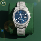 Men’s blue dial moissanite fully iced out watch with sparkling stones, bold luxury design, and polished metal strap for standout style.