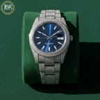 Men’s blue dial moissanite fully iced out watch with sparkling stones, bold luxury design, and polished metal strap for standout style.