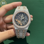 Men’s custom iced out skeleton watch fully flooded with real moissanite stones featuring automatic movement and transparent dial design