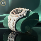 Men’s custom iced out skeleton watch fully flooded with real moissanite stones featuring automatic movement and transparent dial design