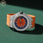 Luxury watch with orange strap and blue face on a green background, featuring JBR Jeweler