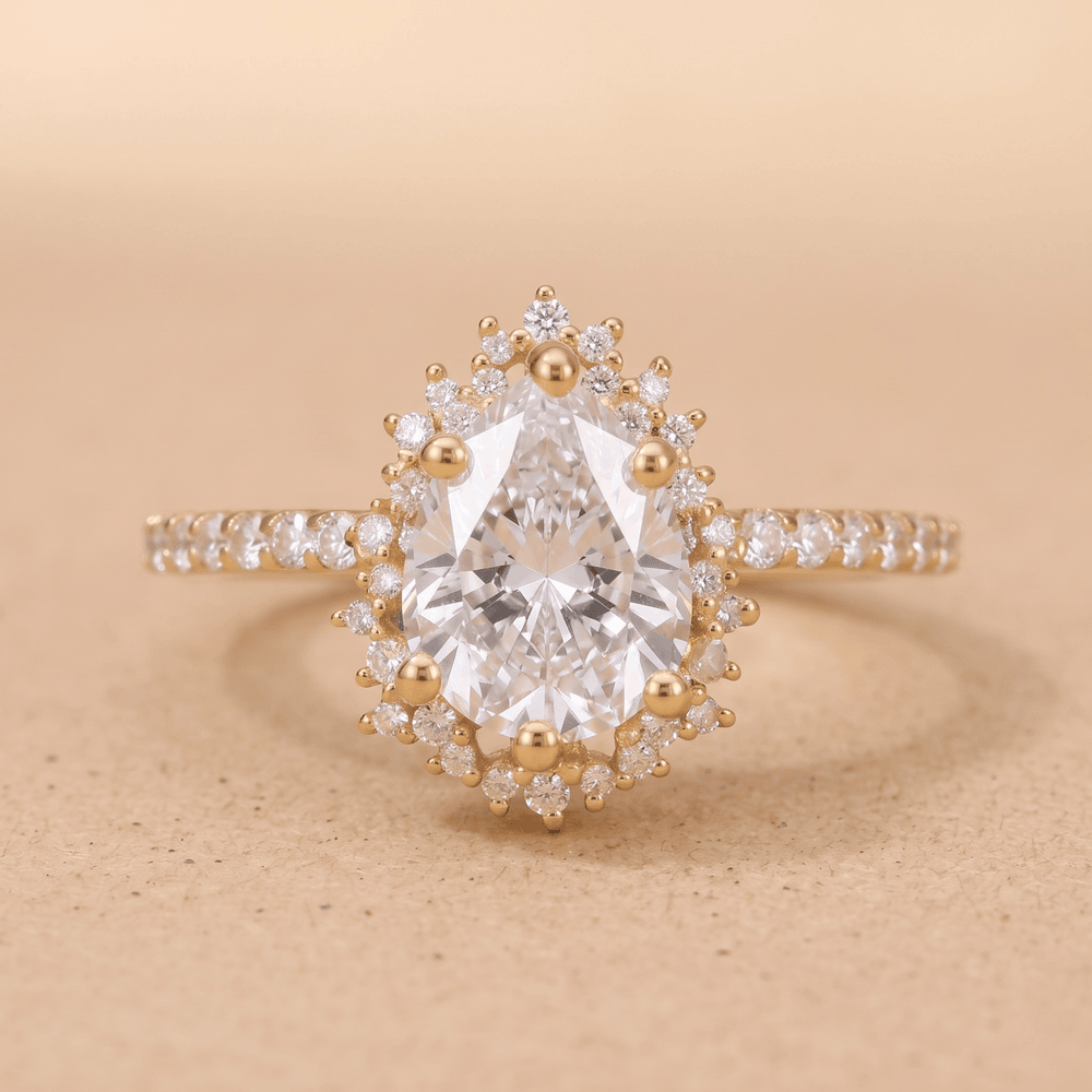 Pear sunburst halo moissanite engagement ring