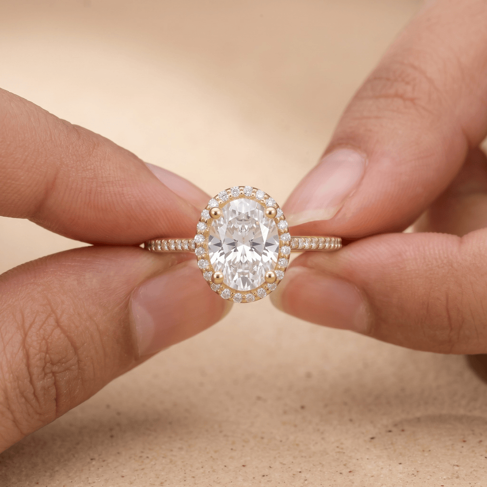 Halo oval diamond promise ring on hand