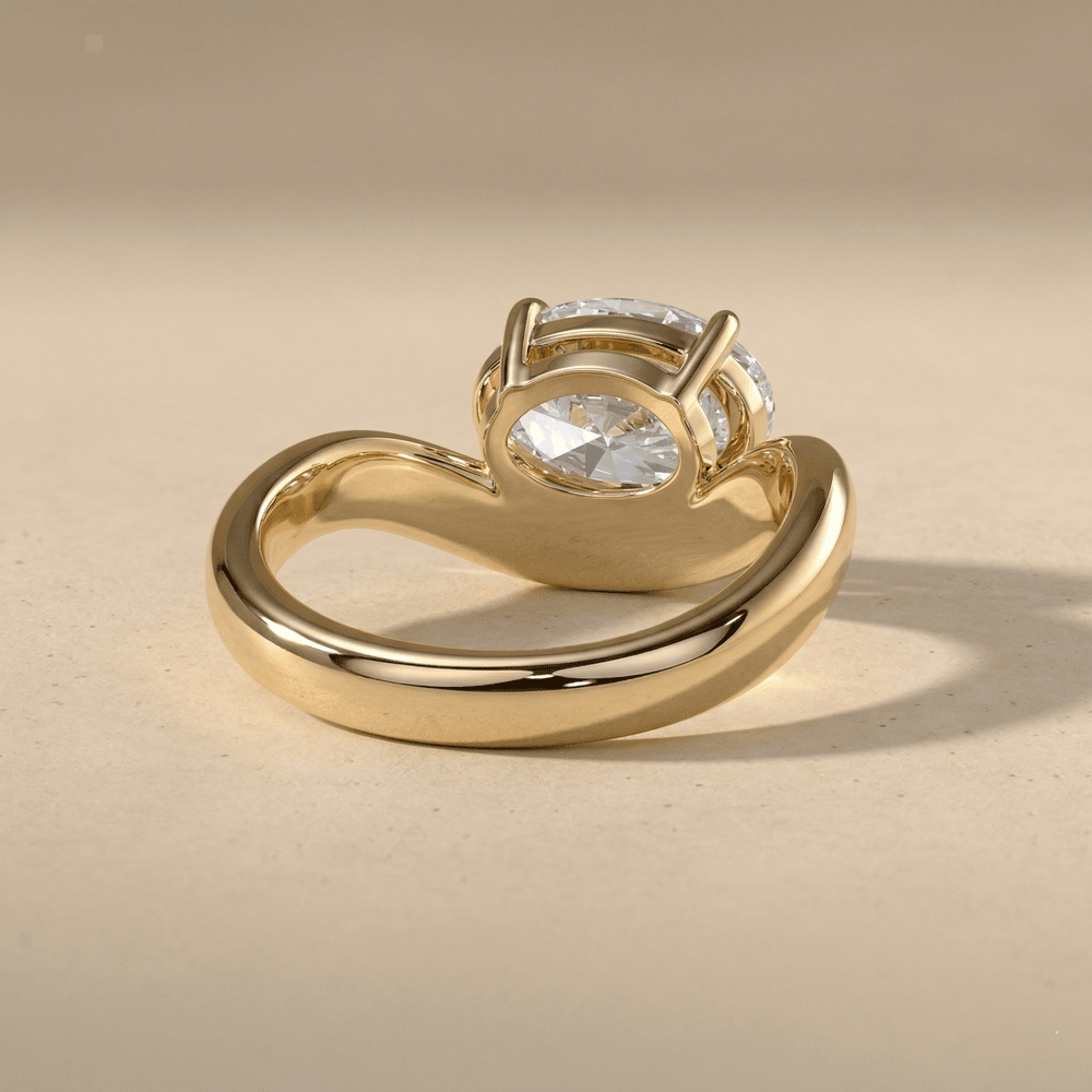 Modern oval lab grown diamond ring with curved gold band