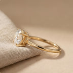 Oval solitaire ring in east west orientation side view