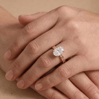 Oval lab diamond ring worn on finger, top angle