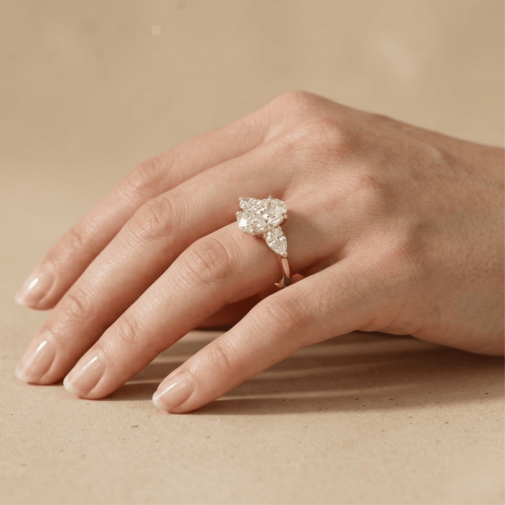 Oval diamond ring with sparkling side stones