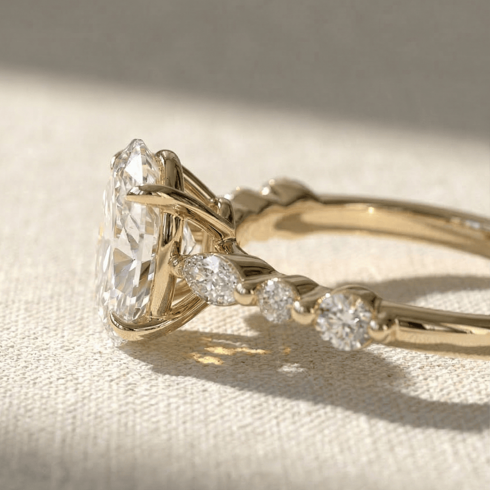 Minimalist oval diamond engagement ring with marquise accents