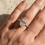 Delicate marquise band engagement ring with oval diamond