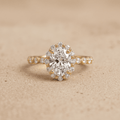 Oval lab diamond ring with shared prong halo setting