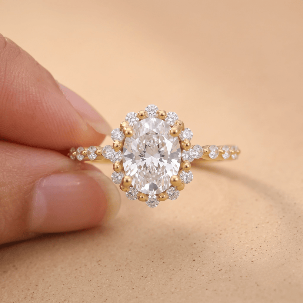 Gold promise ring with oval diamond halo