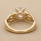 Delicate oval diamond ring with nature inspired design