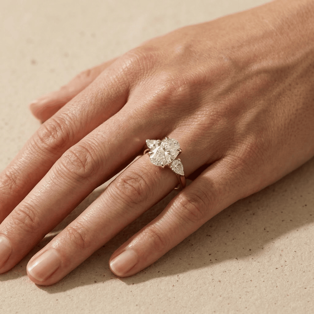 Elegant three stone oval diamond bridal ring