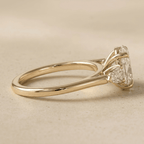 Oval diamond cathedral engagement ring side view