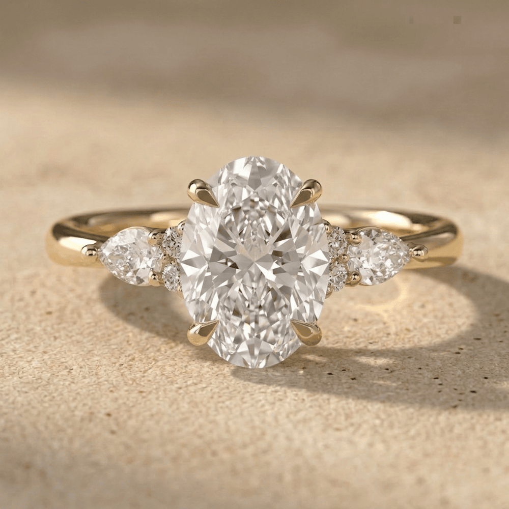 Three stone oval diamond ring in gold
