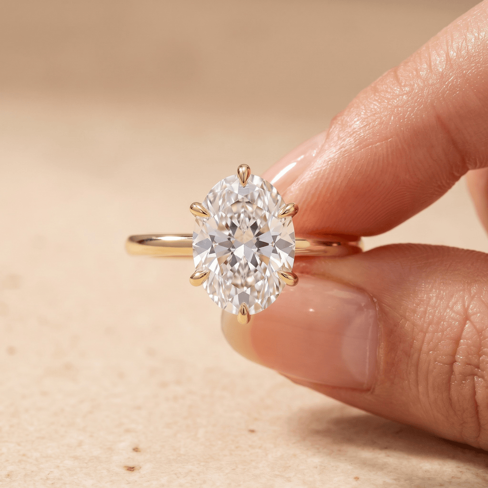 Oval diamond wedding band worn on hand