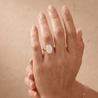 Oval diamond wedding band worn on hand