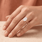 Oval diamond wedding band worn on hand