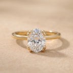 Oval lab grown dual prong bridal ring in 14k gold