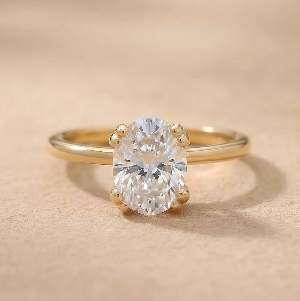 Oval lab grown dual prong bridal ring in 14k gold