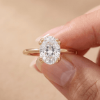 Oval dual prong lab diamond ring worn on hand