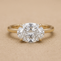 Oval lab grown East West wedding ring in 14k gold