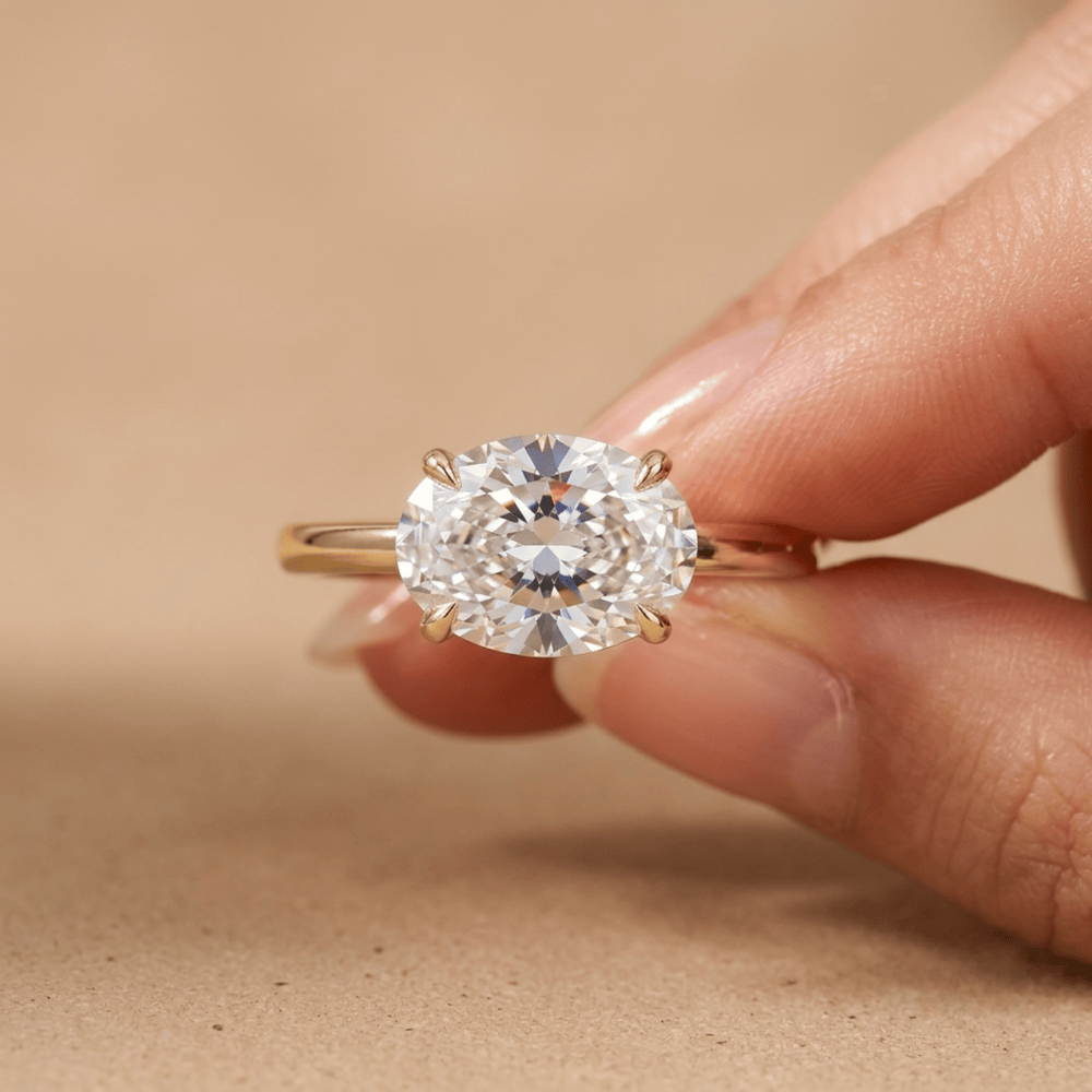 14k gold East West oval diamond band on hand