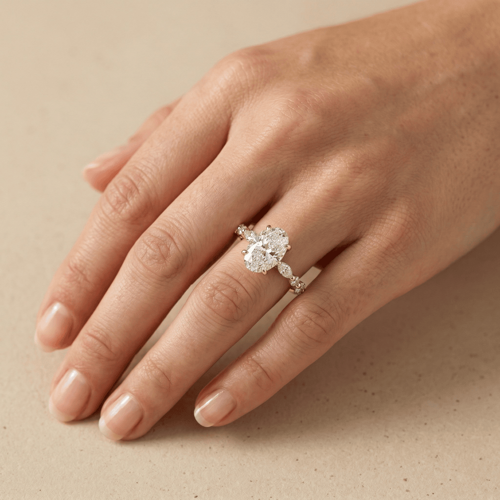 Oval lab diamond bridal ring with side stone detailing