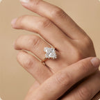 Oval cut moissanite halo ring on finger