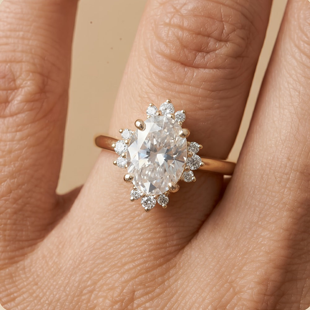 Oval cut moissanite halo ring on finger