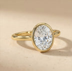 14K bezel set oval moissanite ring close-up