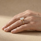 Oval moissanite celestial ring modeled on hand – 18K gold band