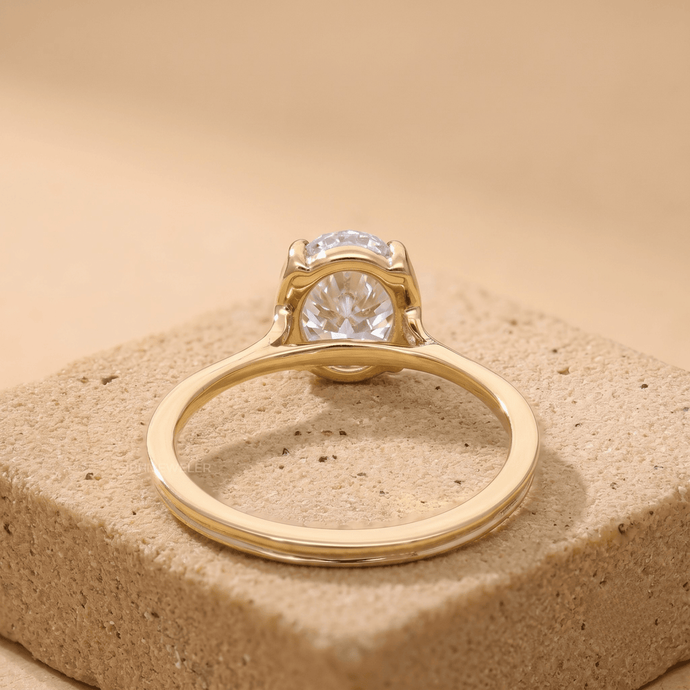 Conflict-free moissanite oval ring in 18K gold, top view