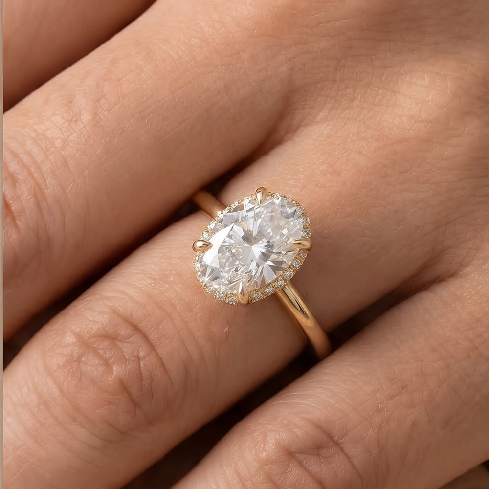 14K gold hidden halo ring worn on hand