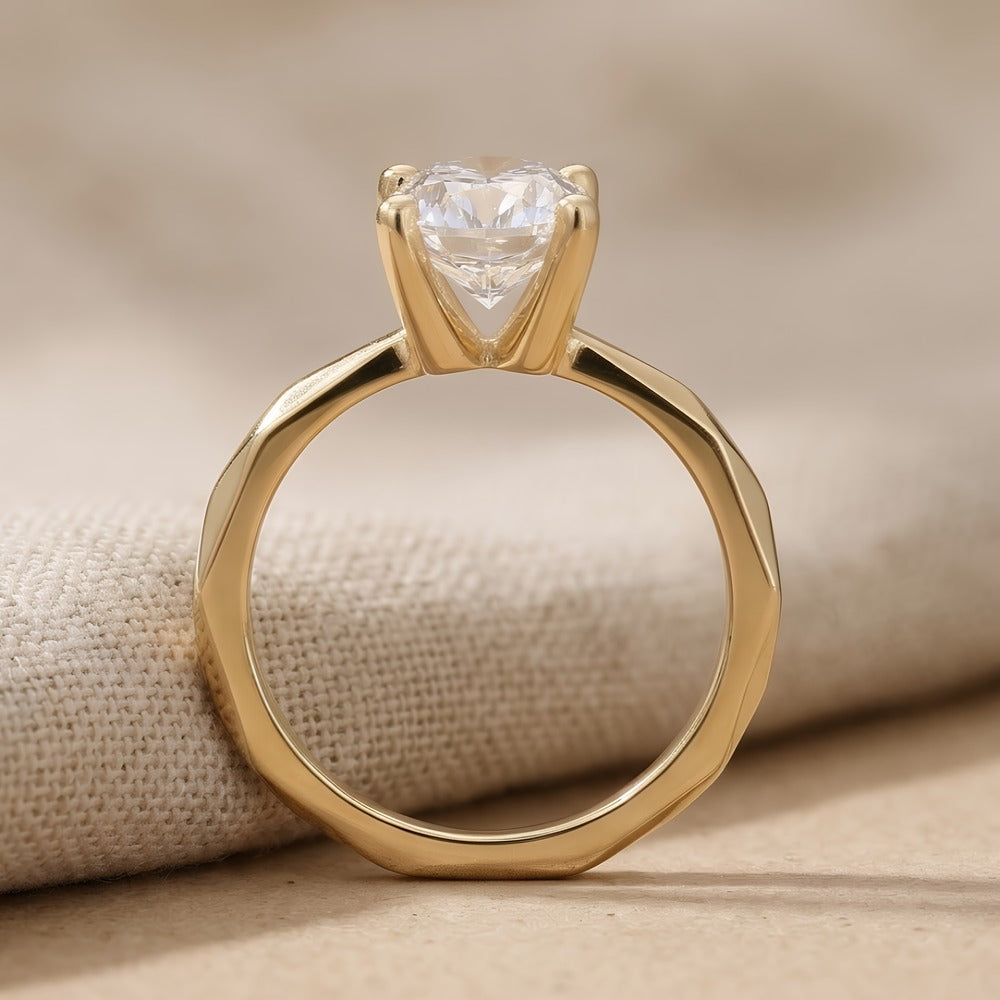 Close-up of oval moissanite stone in gold setting