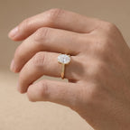 Simple gold solitaire ring with oval moissanite