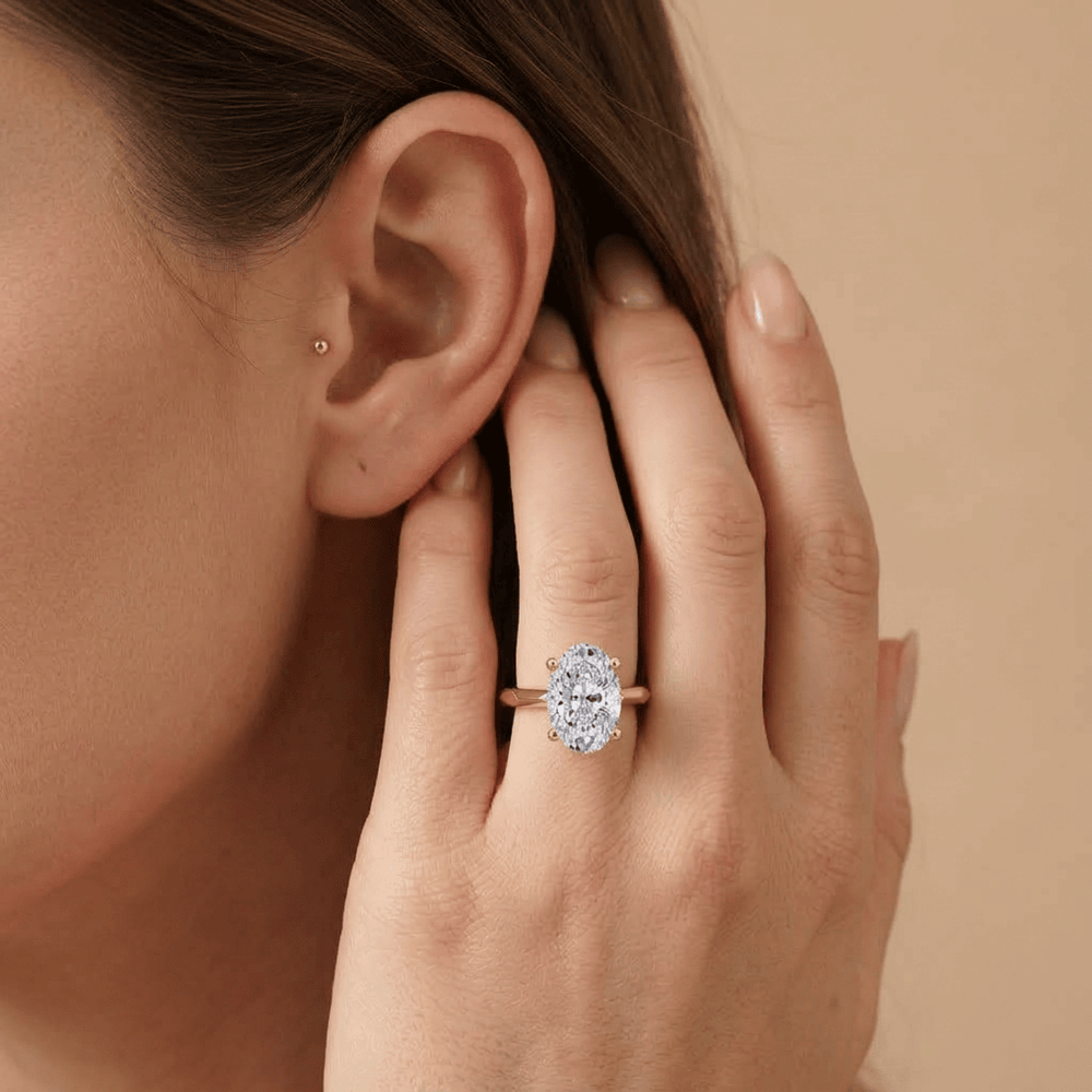 Oval moissanite ring worn on hand
